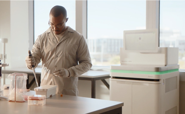 Scientist, pipetting into library tube in NovaSeq 6000 cluster reagent cartridge